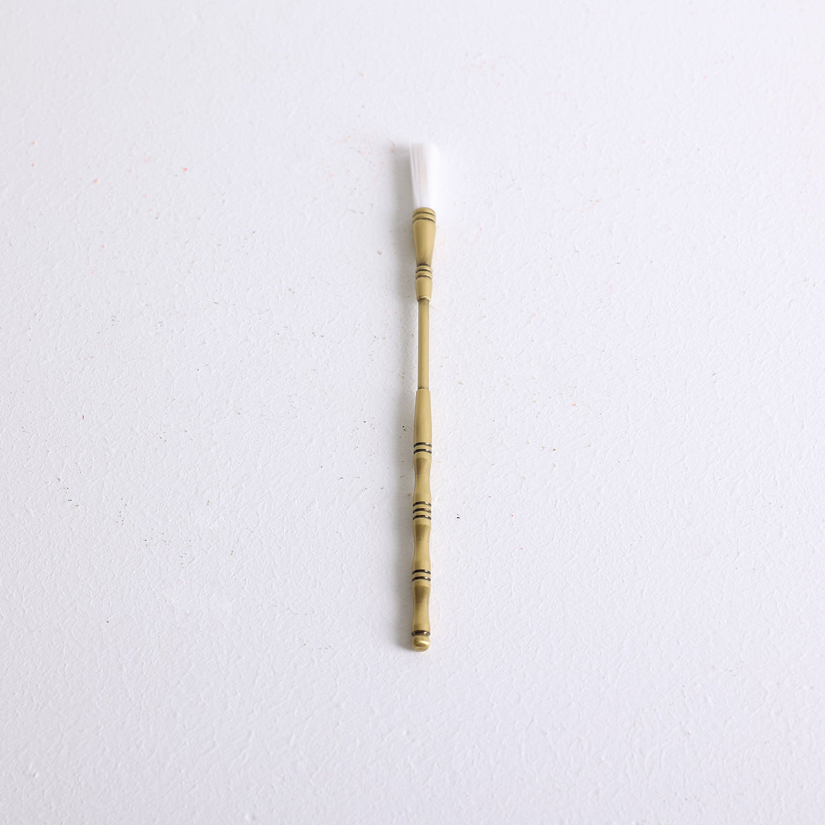 A bronze incense sweeper for sweeping loose ash and powder on incense burners