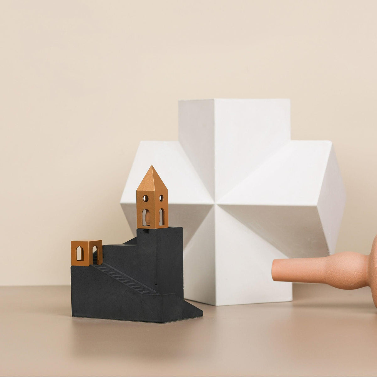 Cloud Keep Backflow Incense Burner by Kin Objects next to table ornaments