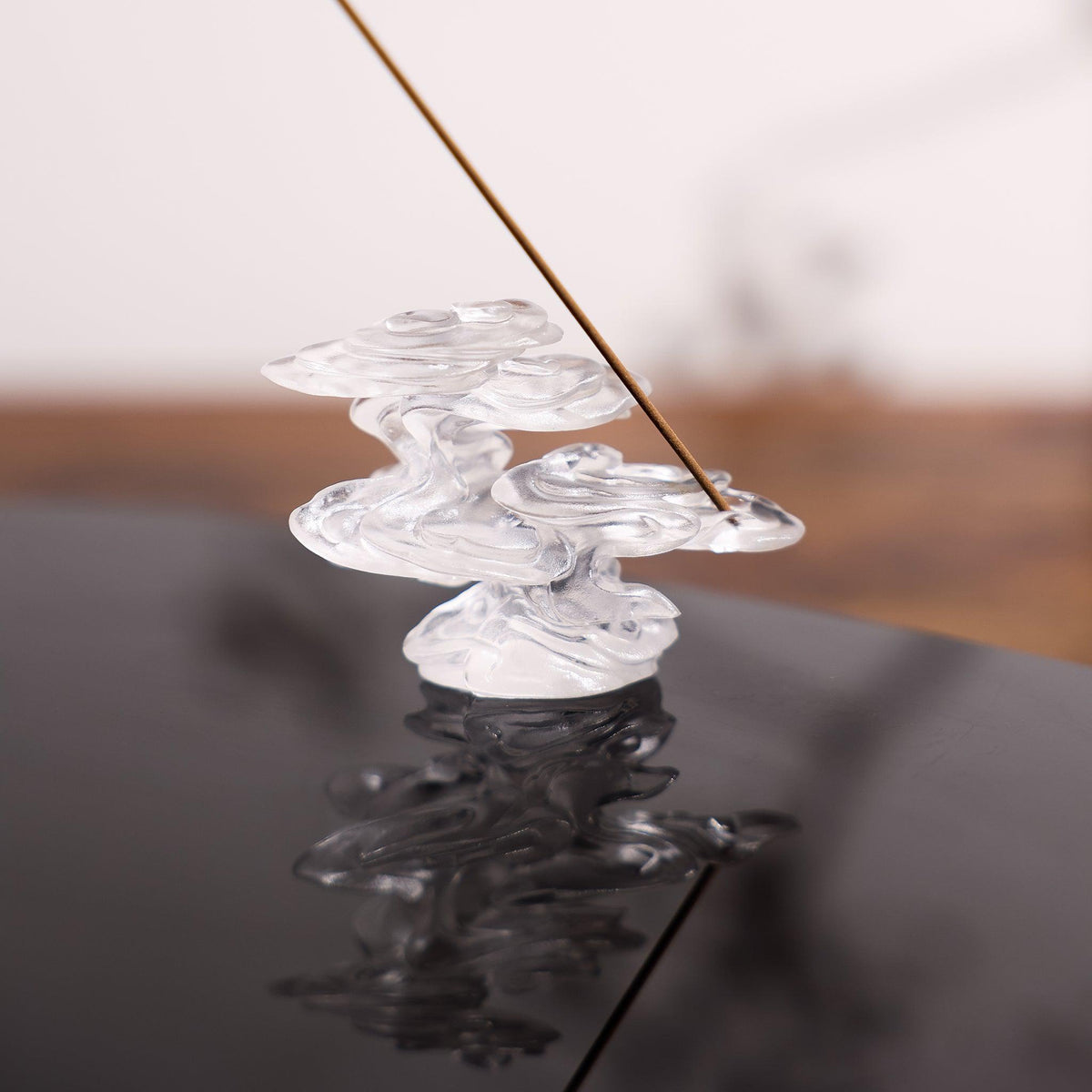 Ethereal Clouds incense holder on a black table