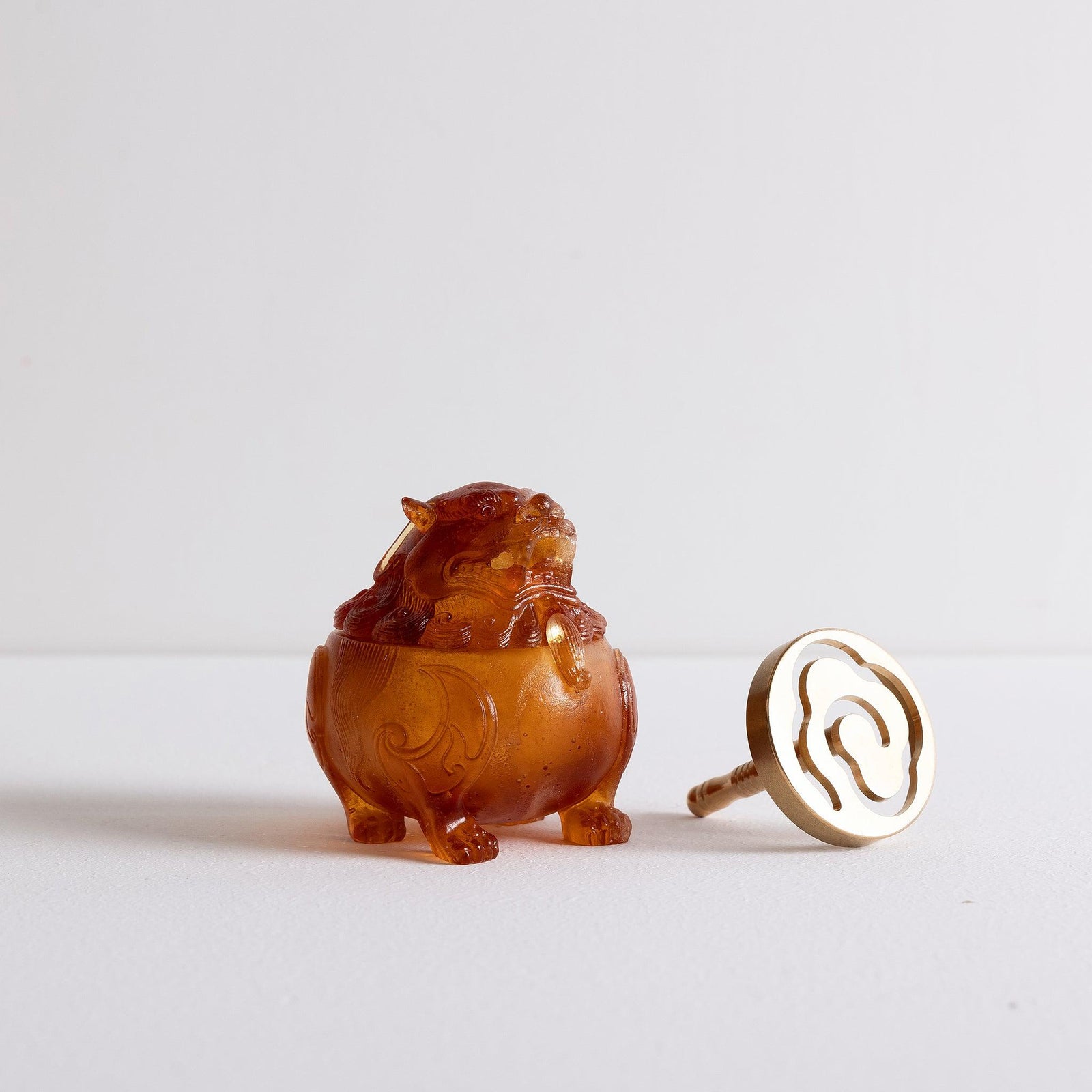 Kin Object's liuli glass mythical lion powder incense burner with smoke coming out