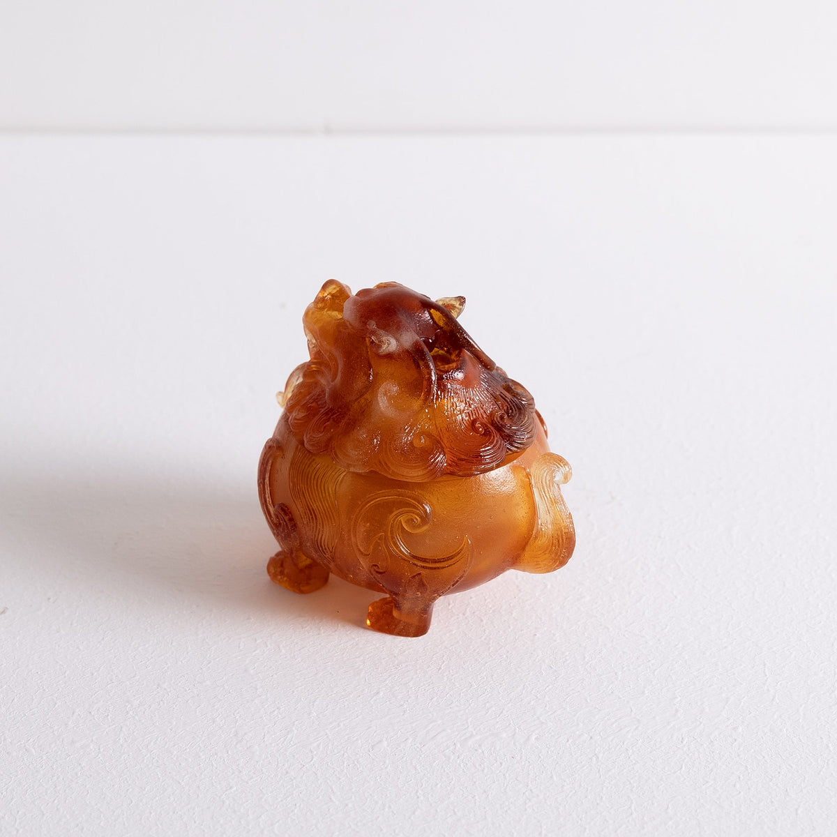 Back angled view of Kin Object's liuli glass mythical lion powder incense burner