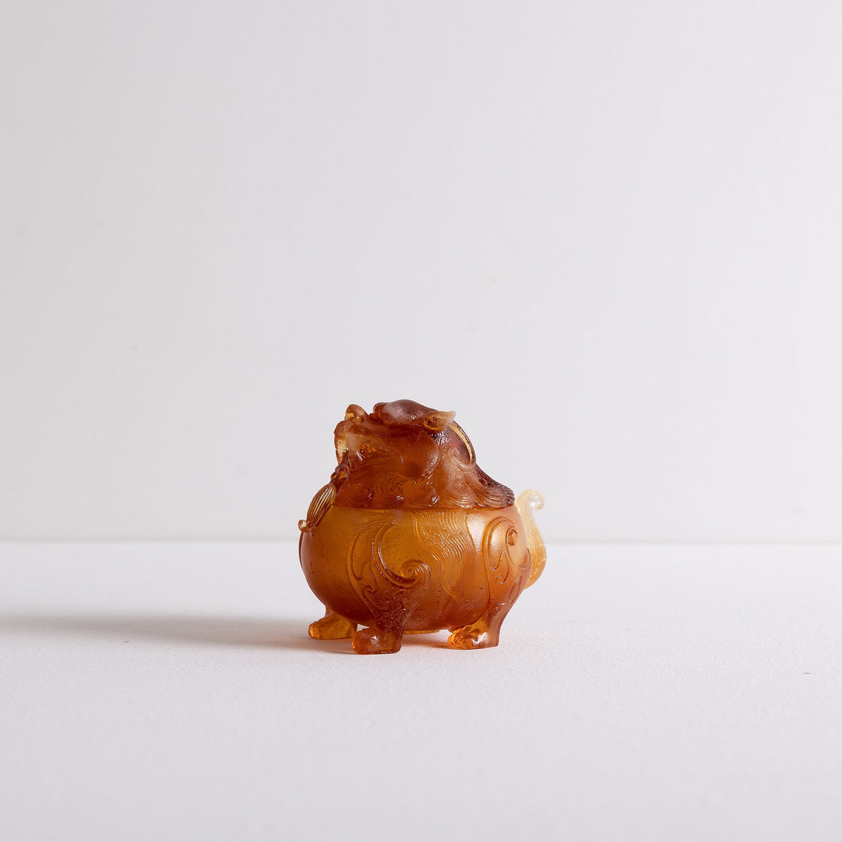 Side view of liuli Suanni Lion incense powder burner by Kin Objects