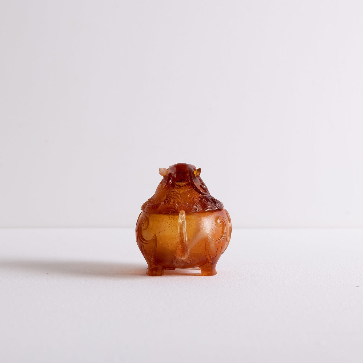 Back view of Kin Object's glass mythical lion powder incense burner