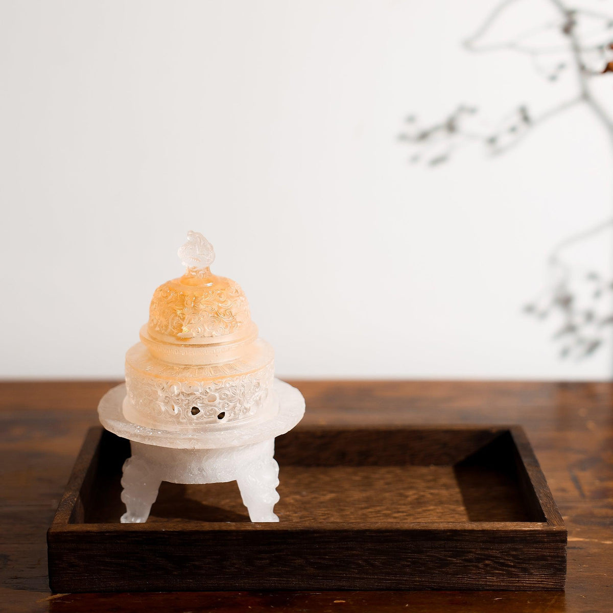 The Monument liuli glass incense powder burner on a wooden tray