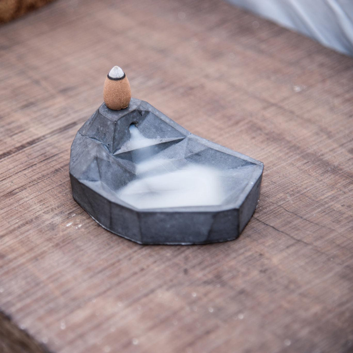 Mountain & Lake Incense Waterfall by Kin Objects on a Wooden Table