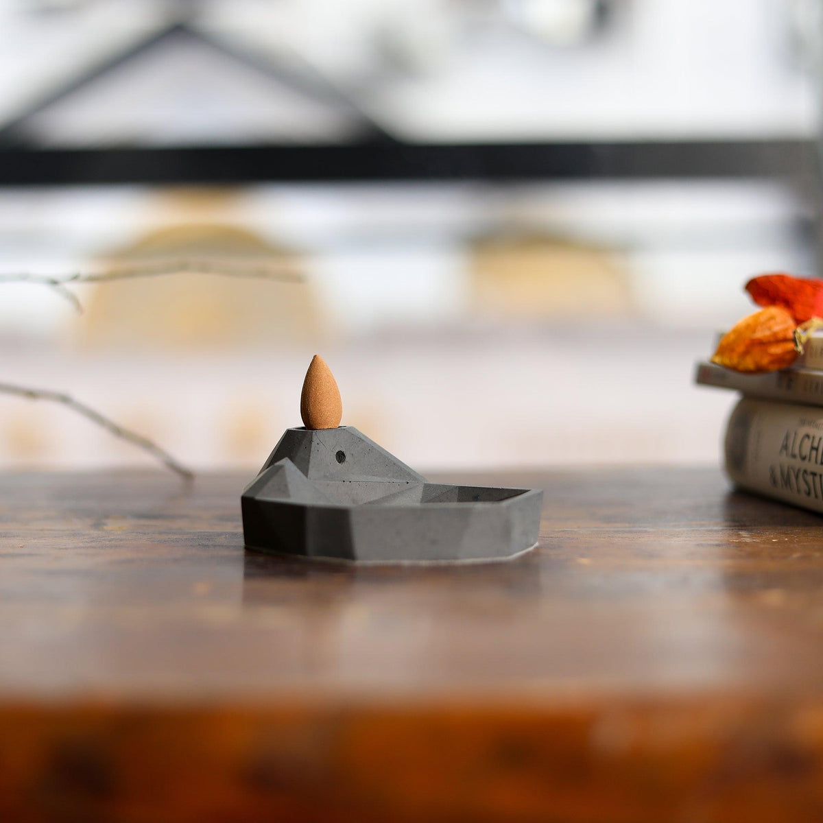 Front view of modern Mountain & Lake backflow incense burner on a table