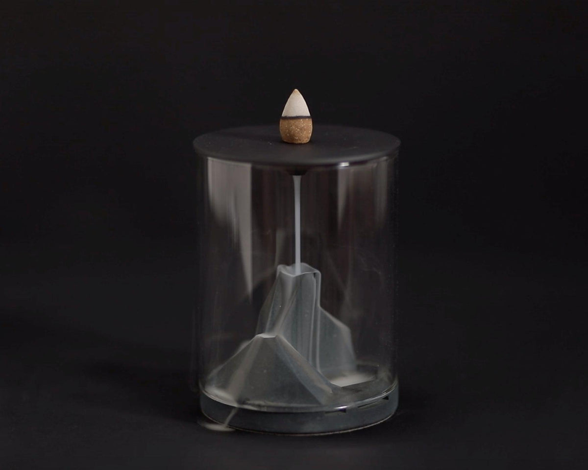 Incense smoke flowing in Caldera Terrarium Backflow Incense Burner by Kin Objects