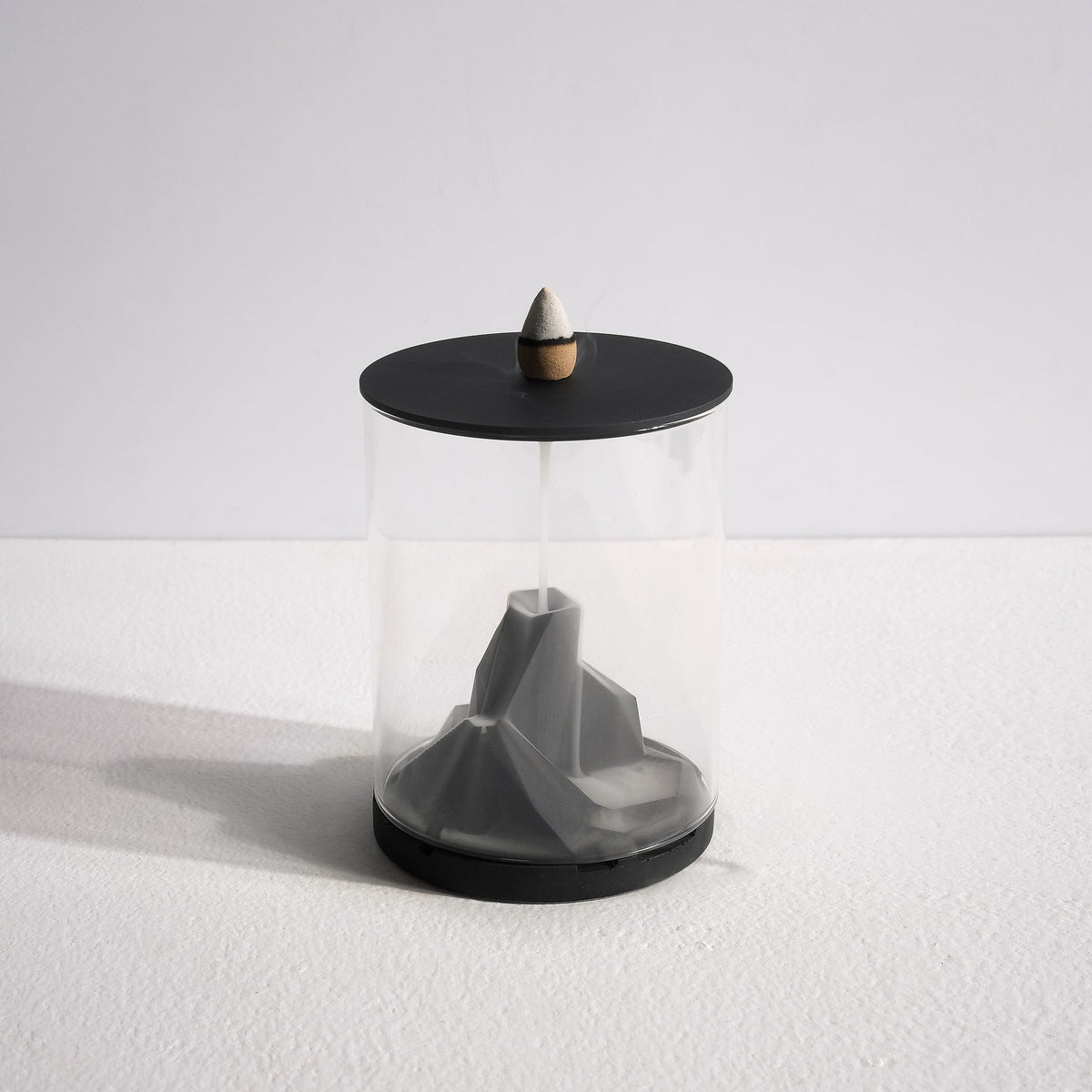 Smoke flowing down Caldera Terrarium Incense Fountain