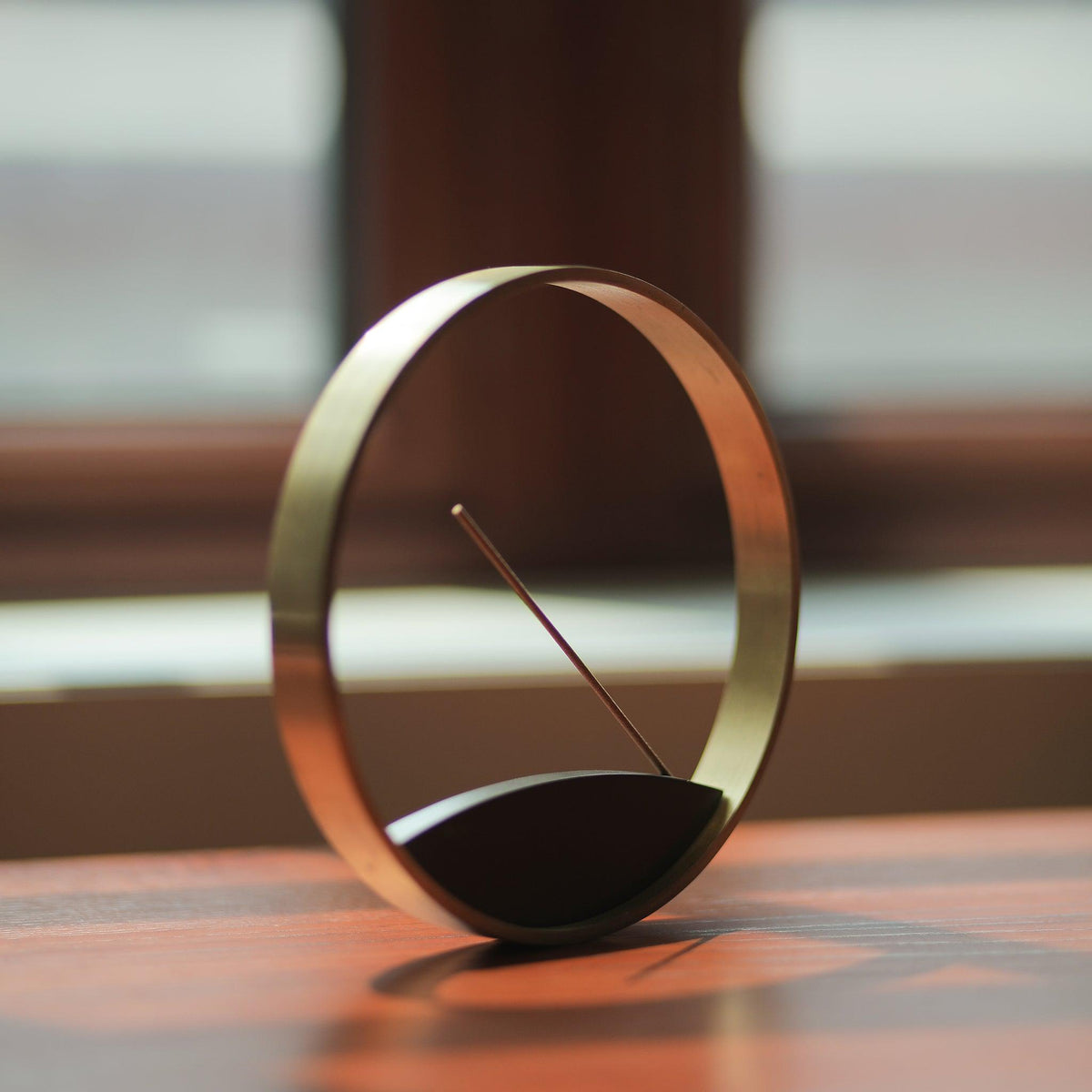 Angled view of Moon Horizon incense burner by Kin Objects