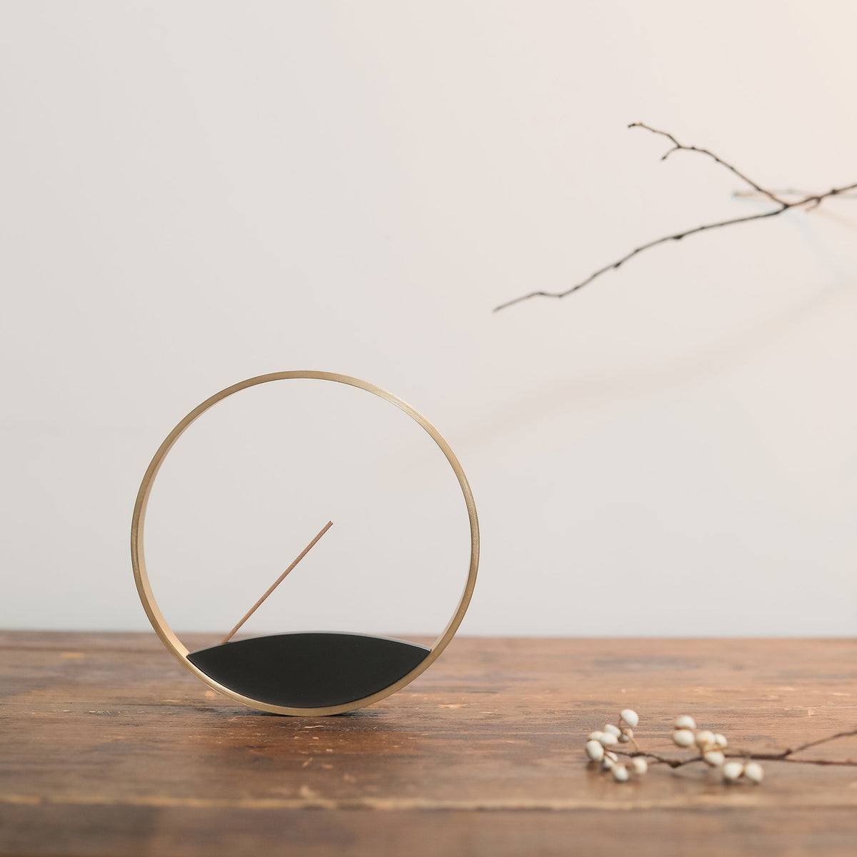Full view of modern brass incense holder Moon Horizon