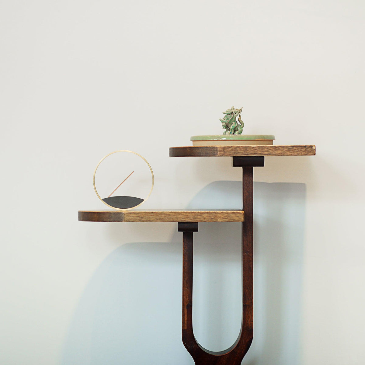 Modern sophisticated circular incense burner in a home setting