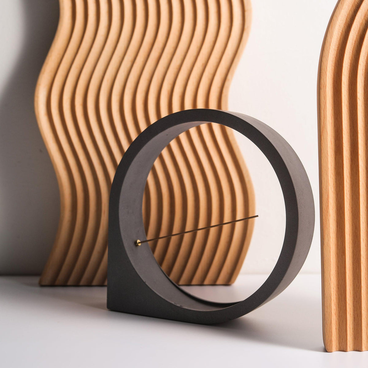 A modern minimal incense holder against wooden boards