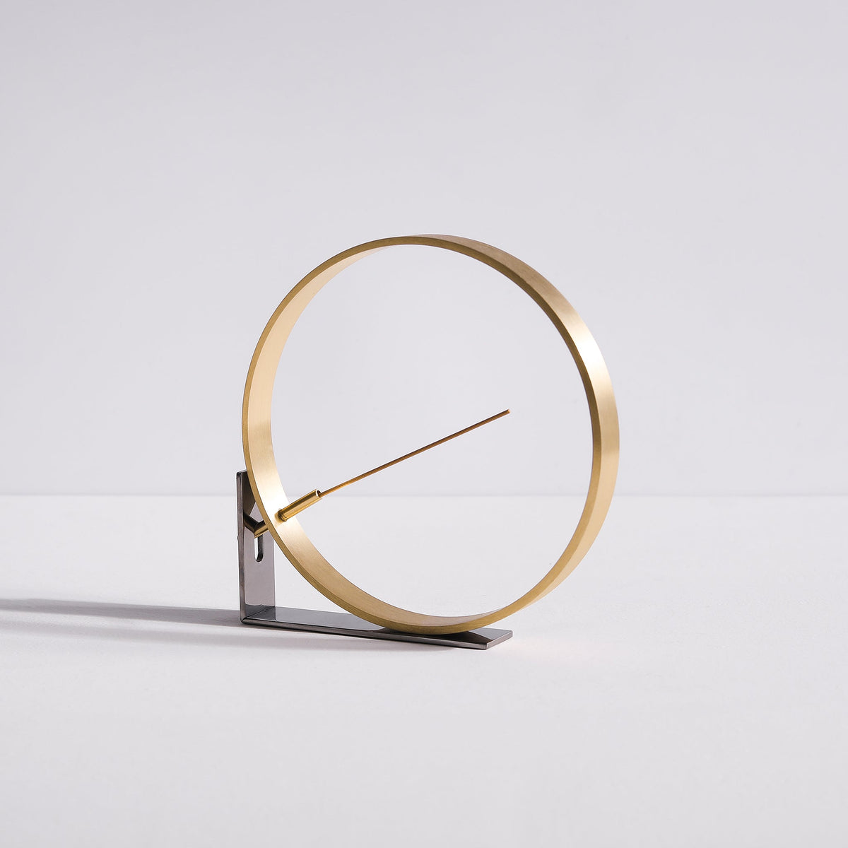 Front angled view of minimal bronze incense burner by Kin Objects