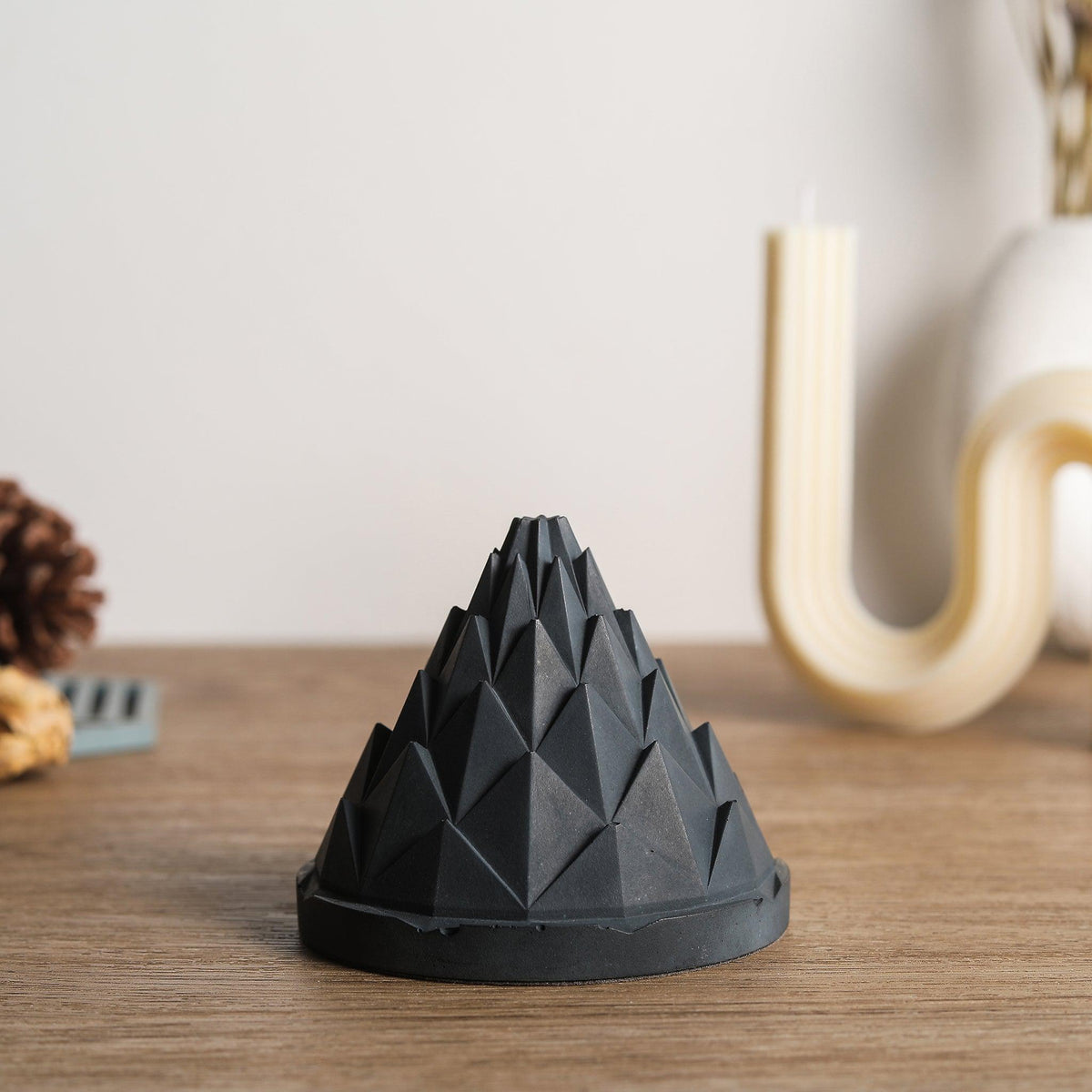 Close up of a modern Terrarium Backflow Incense Burner by Kin Objects
