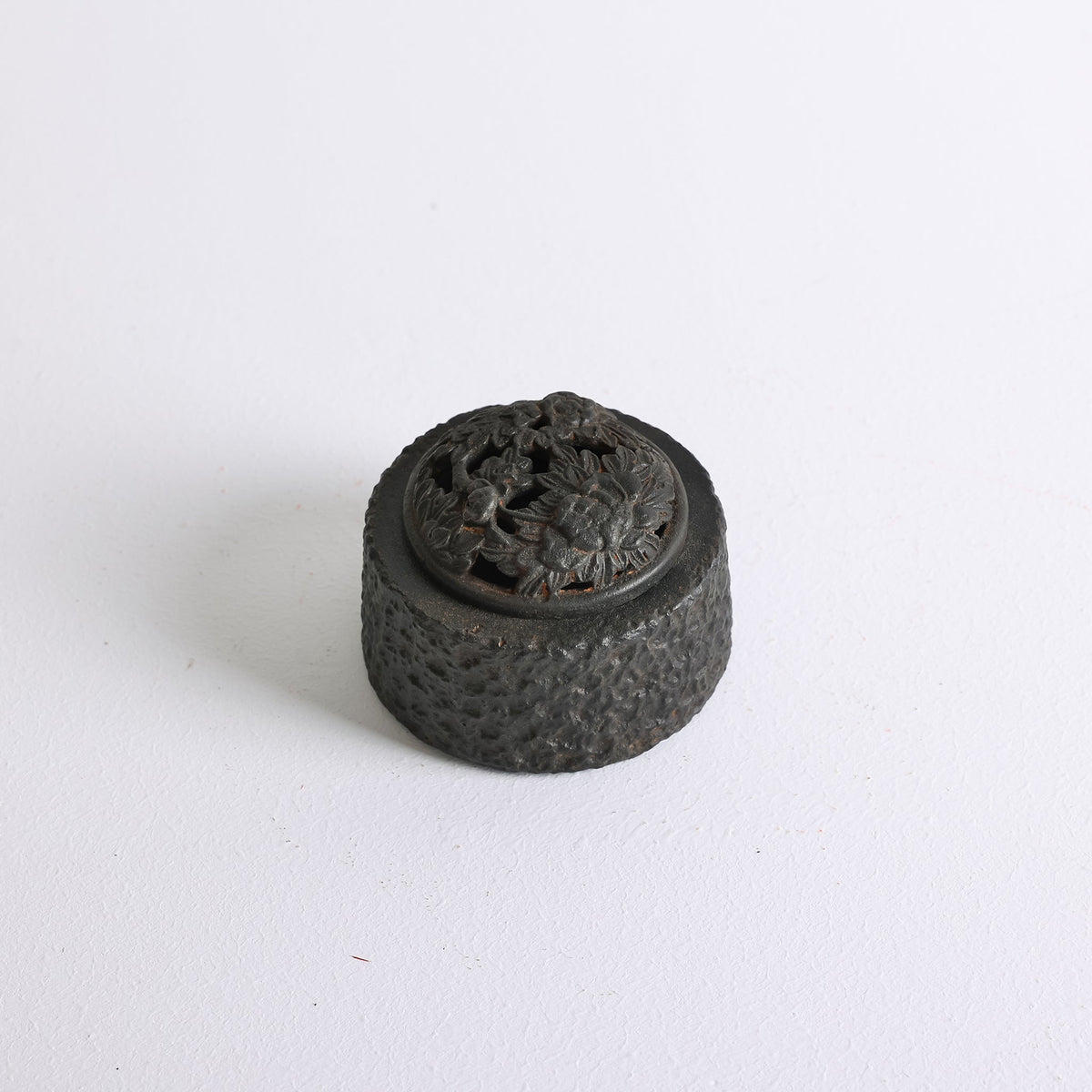 Top angled view of Earthen Peony Cast Iron incense burner for powder incense