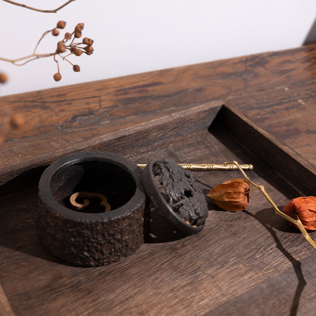 An incense burning for powder incense with smoke coming out