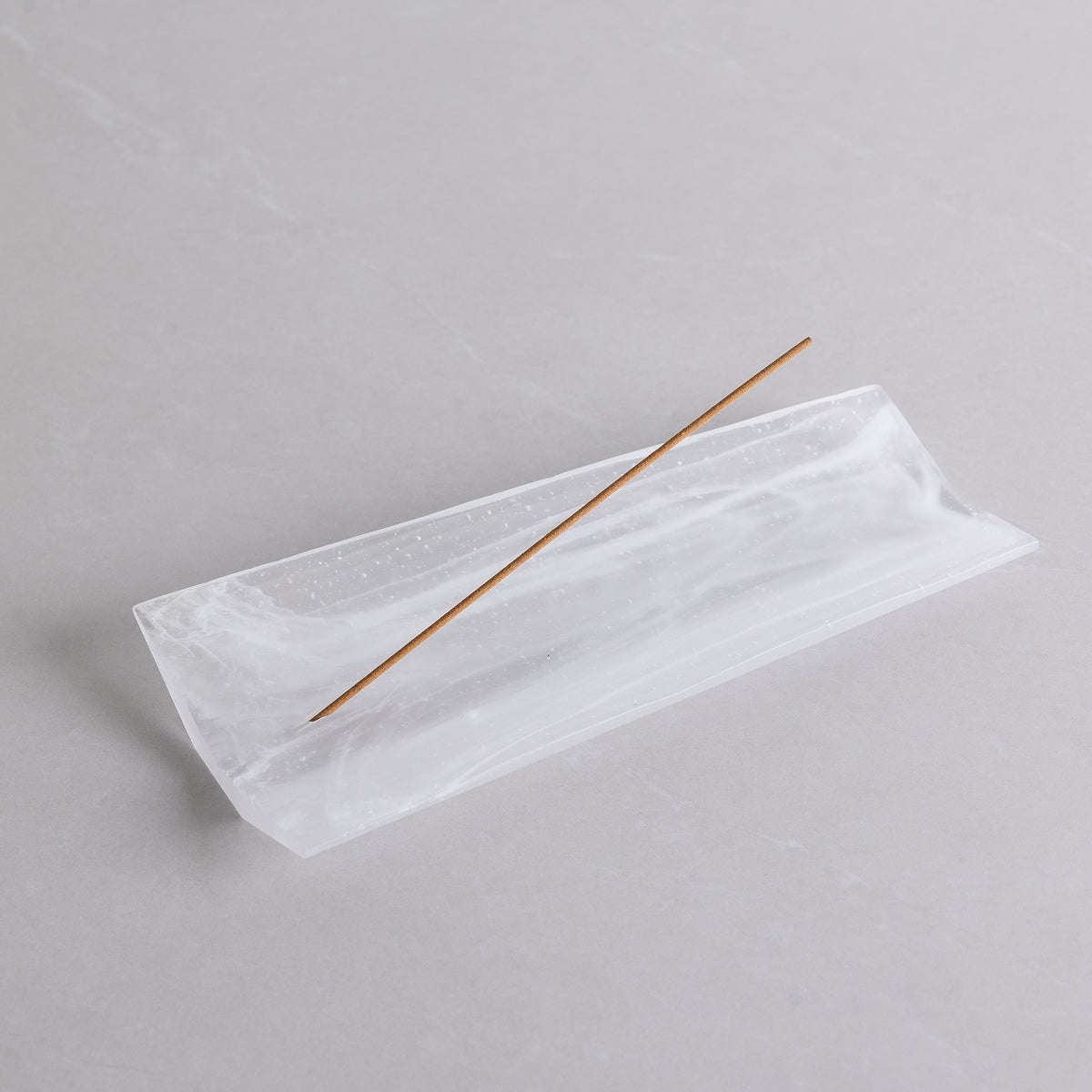 Unique glass incense holder with swirling pattern by Kin Objects