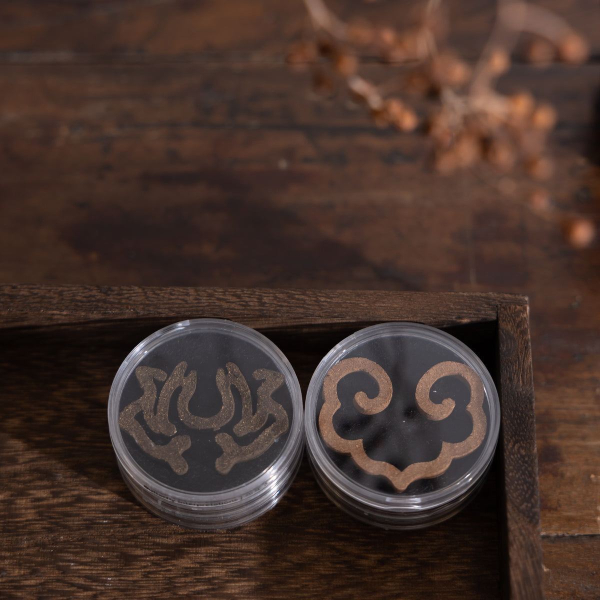 Close-up of ready-touse incense seals in clear plastic containers by Kin Objects, part of 8-piece mix set