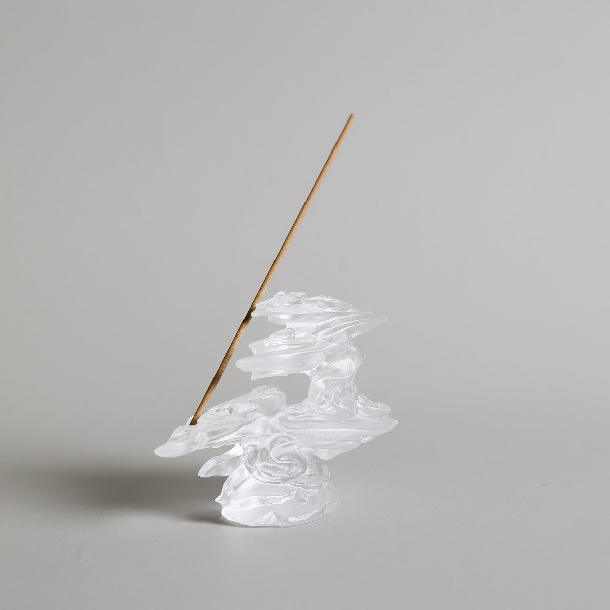 Angled view of cloud inspired liuli crystal art incense burner