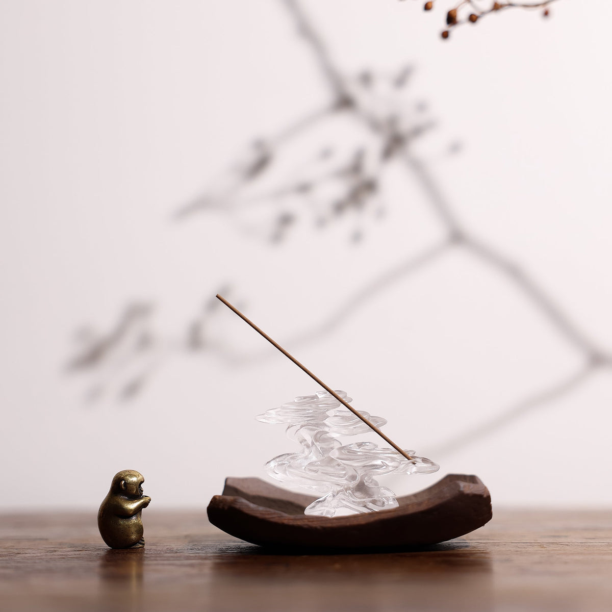 The Ethereal Clouds incense holder on a curved wooden plate
