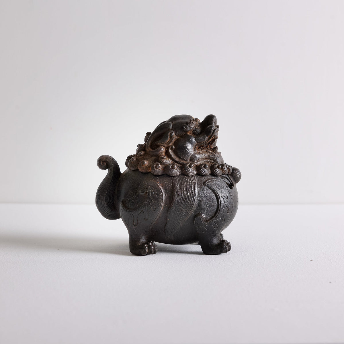 Side view of cast iron suanni lion incense burner Kin Objects
