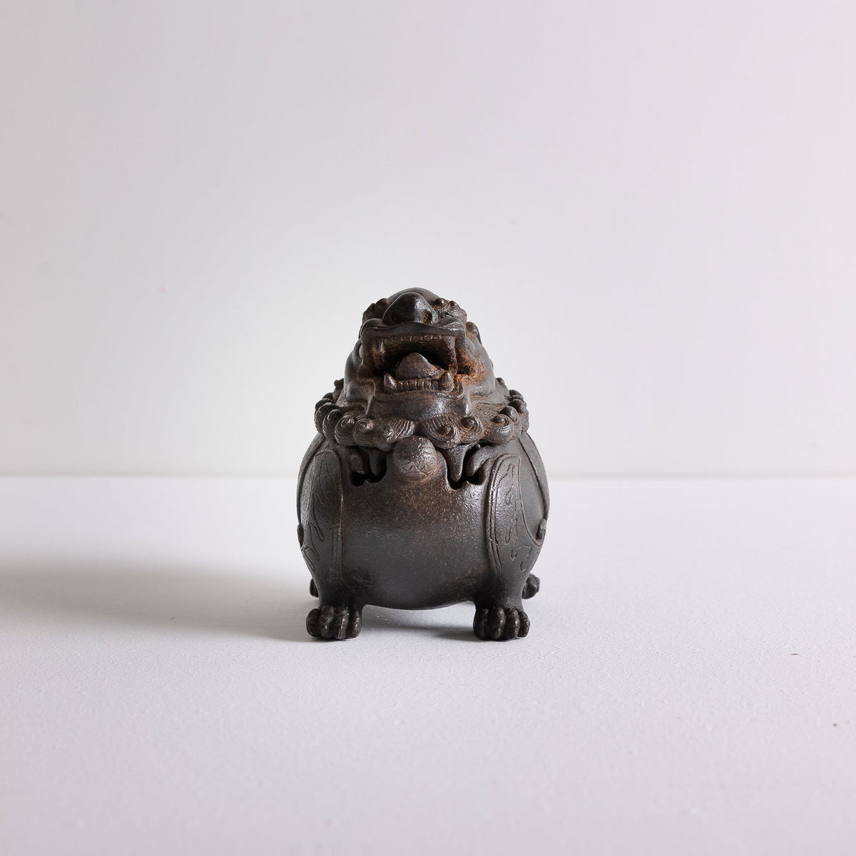 Front view of cast iron suanni lion incense burner for powder incense