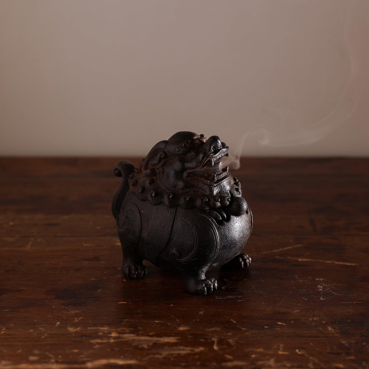 Smoking rising from suanni lion incense burner