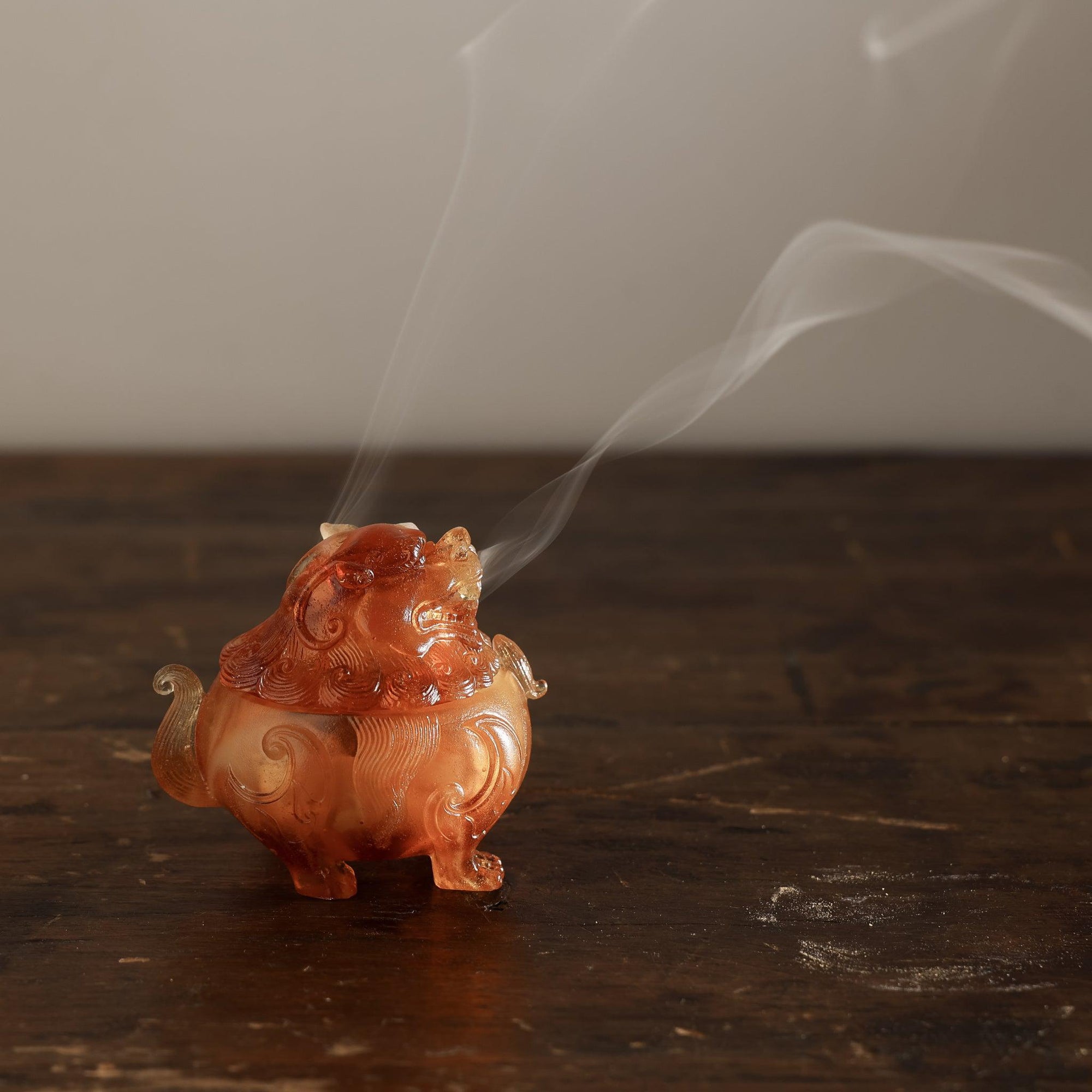 Kin Object's liuli glass mythical lion powder incense burner with smoke coming out