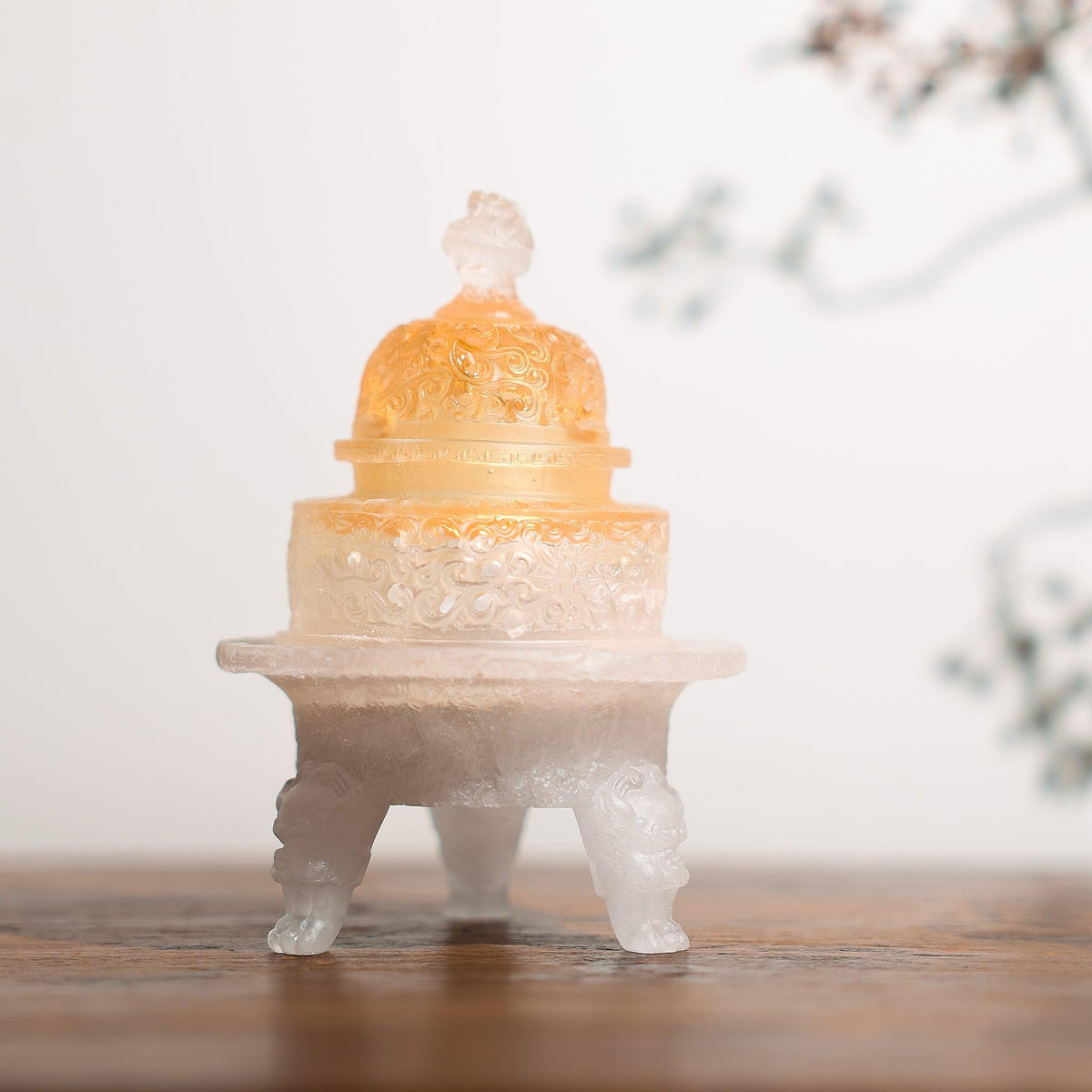 The lid of a liuli glass incense powder burner turns amber from use