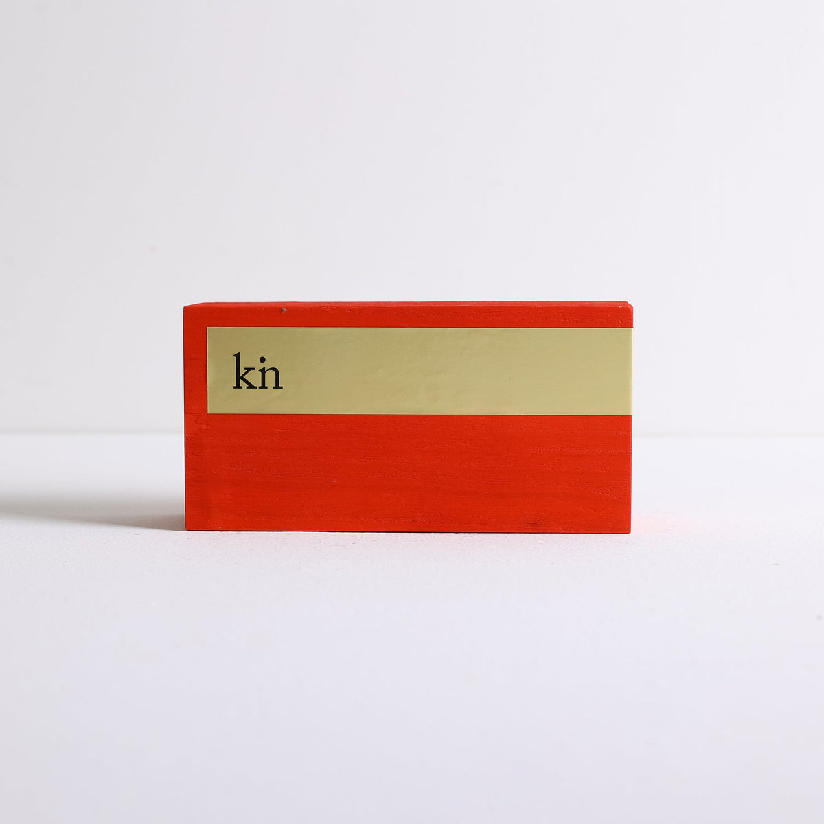 A red wooden box for incense sticks by Kin Objects