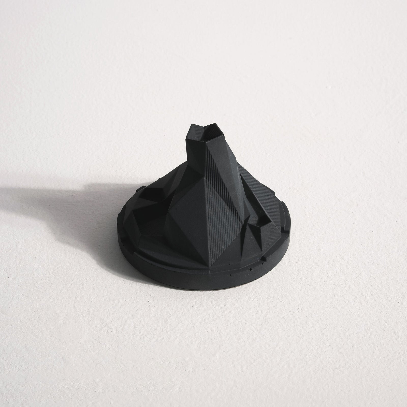 Caldera Terrarium Incense Fountain by Kin Objects on Table next to other Decor