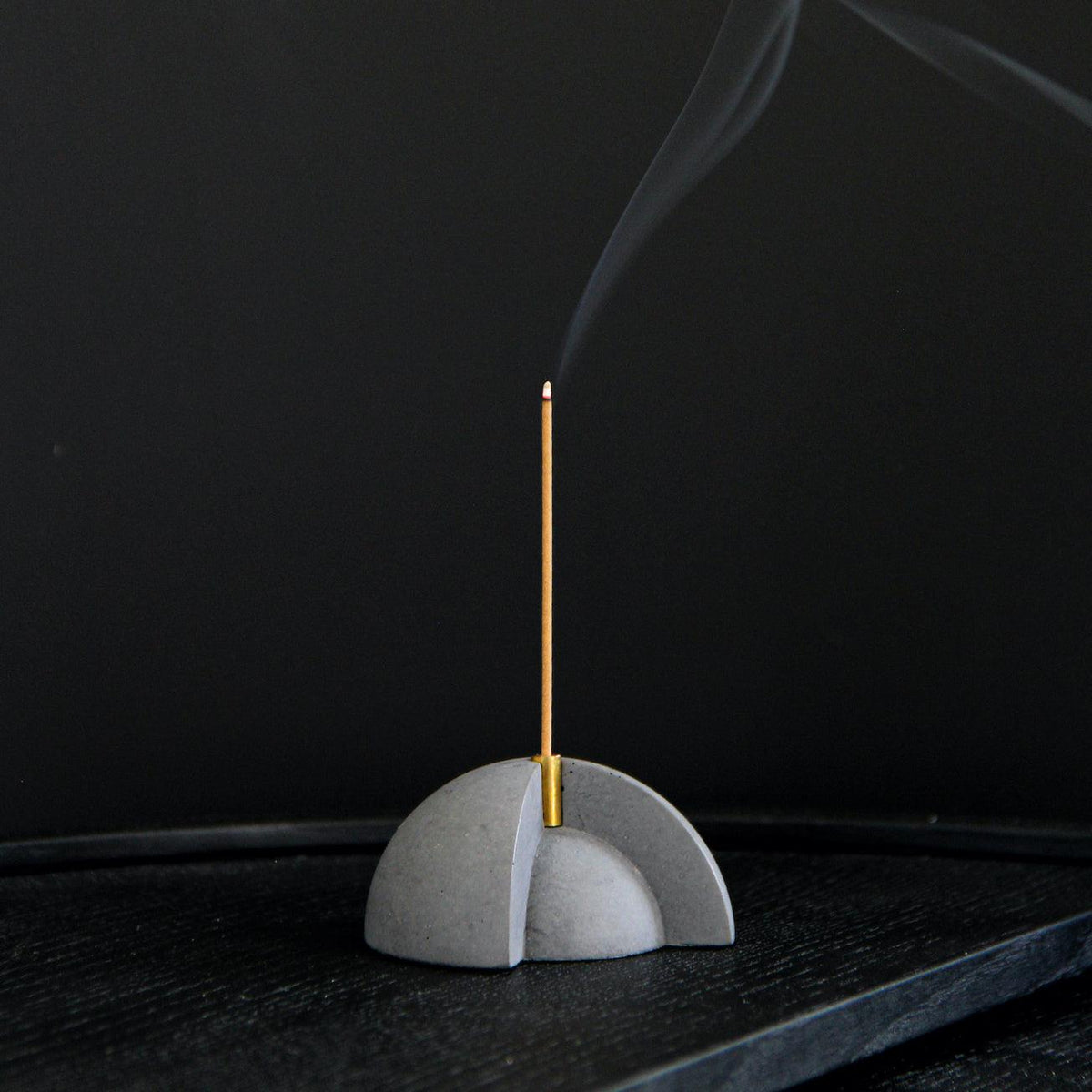 Core Incense Holder by Kin Objects against black background