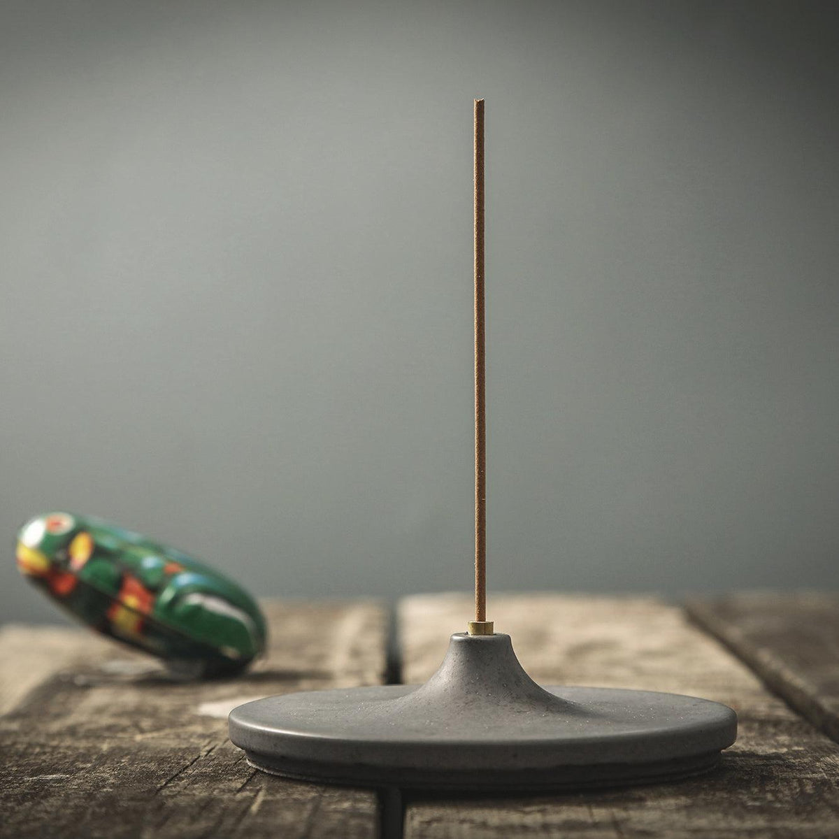 Disk incense burner on a table