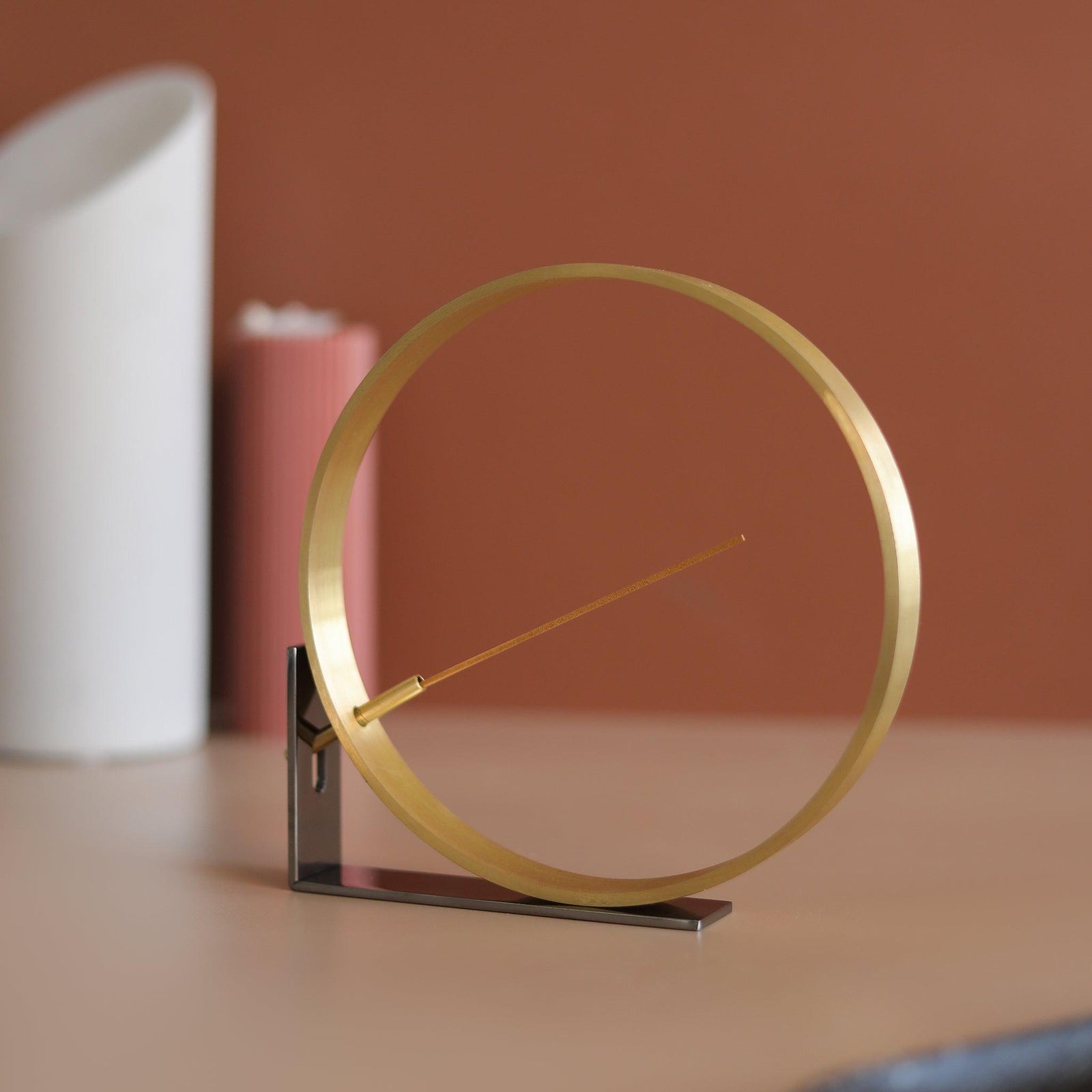 Front angled view of minimal bronze incense burner by Kin Objects