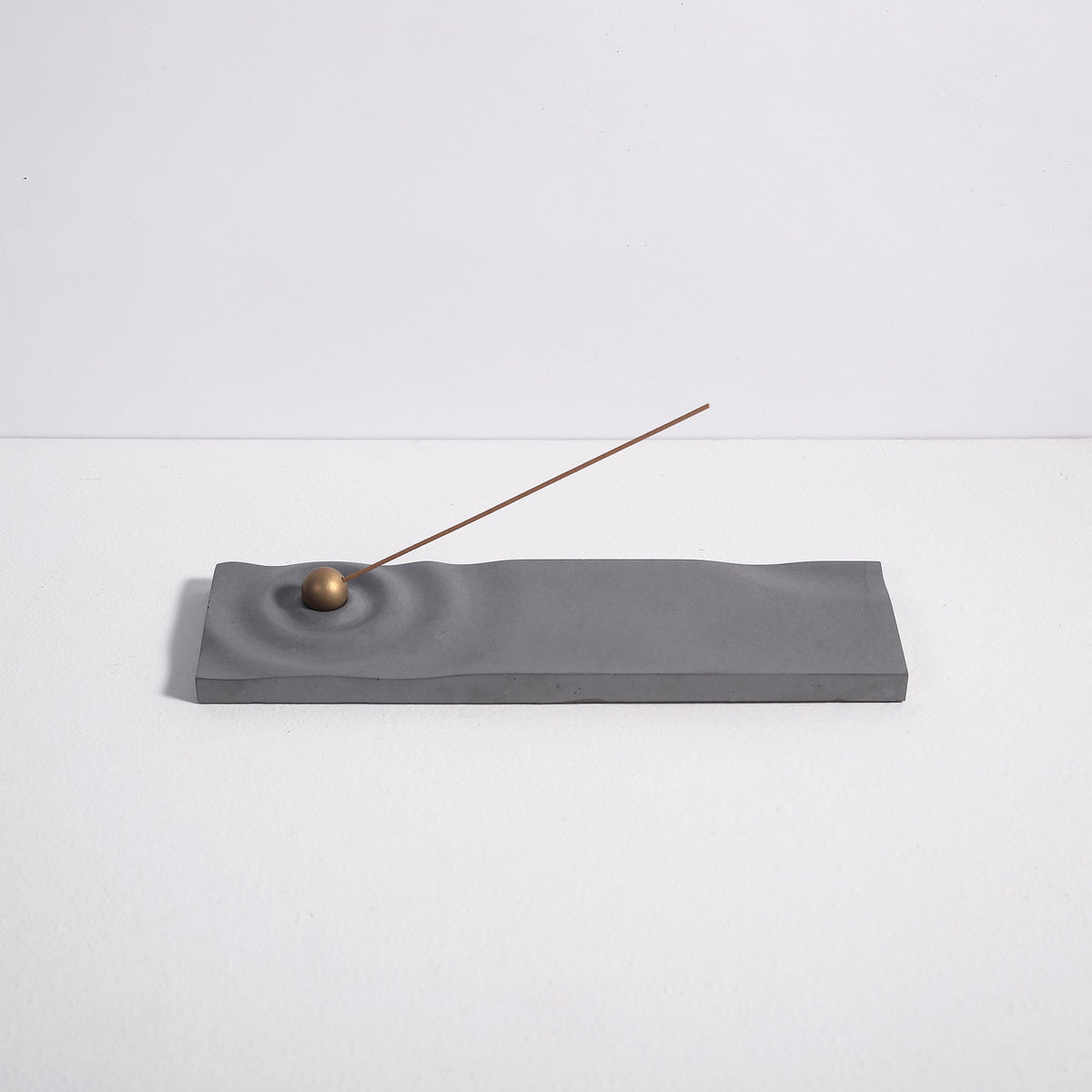 Ripple incense burner in gray by Kin Objects for incense sticks side view